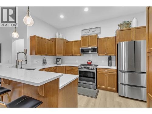 New Stainless Steel Appliances - 2455 Quail Ridge Boulevard Unit# 213, Kelowna, BC - Indoor Photo Showing Kitchen With Stainless Steel Kitchen