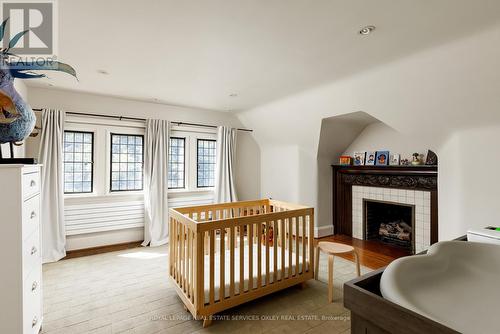 5 Thornwood Road, Toronto, ON - Indoor Photo Showing Bedroom With Fireplace