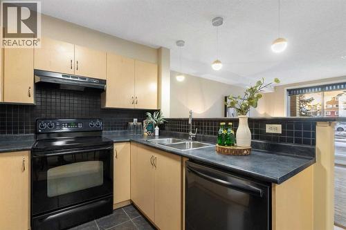 4104, 10 Prestwick Bay Se, Calgary, AB - Indoor Photo Showing Kitchen With Double Sink