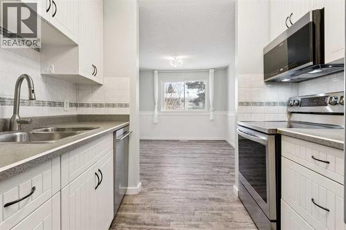 10618 Braeside Drive Sw, Calgary, AB - Indoor Photo Showing Kitchen With Double Sink
