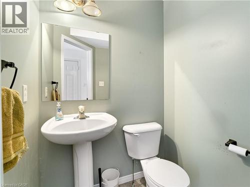 Bathroom with toilet and baseboards - 47 Schroder Crescent, Guelph, ON - Indoor Photo Showing Bathroom