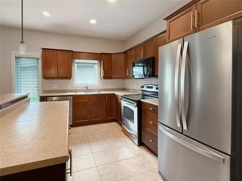 12 Augusta Crescent, Brandon, MB - Indoor Photo Showing Kitchen With Double Sink