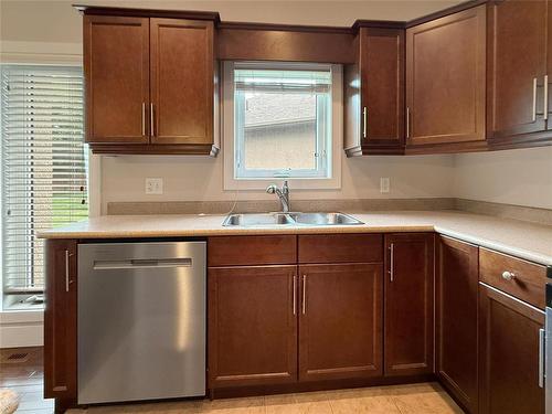 12 Augusta Crescent, Brandon, MB - Indoor Photo Showing Kitchen With Double Sink