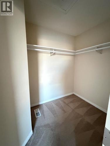 walk in closet - 234 Pacific Crescent, Fort Mcmurray, AB - Indoor With Storage