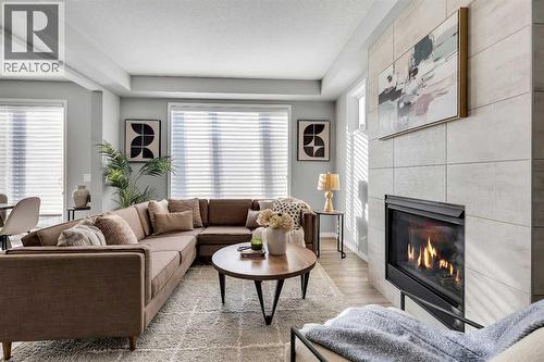 138 Cityside Way Ne, Calgary, AB - Indoor Photo Showing Living Room With Fireplace