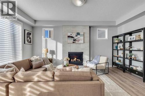138 Cityside Way Ne, Calgary, AB - Indoor Photo Showing Living Room With Fireplace