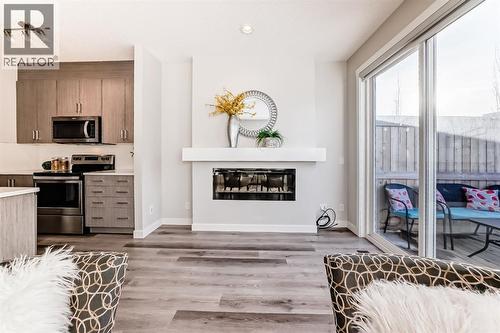 267 Sage Bluff Rise Nw, Calgary, AB - Indoor Photo Showing Other Room With Fireplace