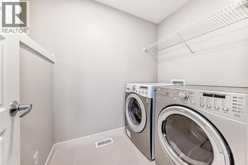 267 Sage Bluff Rise Nw, Calgary, AB - Indoor Photo Showing Laundry Room