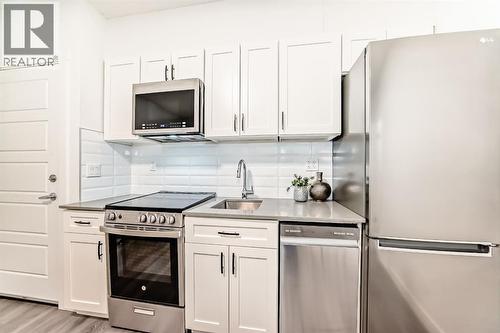267 Sage Bluff Rise Nw, Calgary, AB - Indoor Photo Showing Kitchen With Upgraded Kitchen