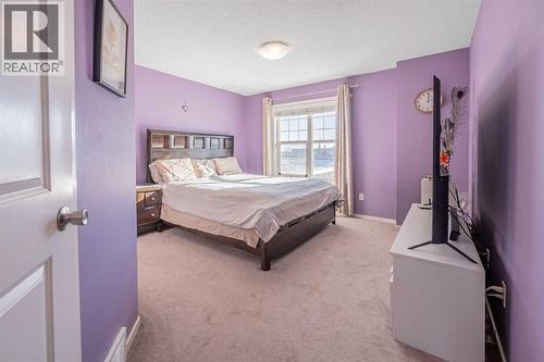 180 Panatella Way Nw, Calgary, AB - Indoor Photo Showing Bedroom