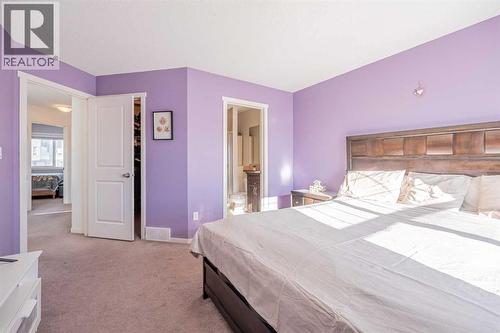 180 Panatella Way Nw, Calgary, AB - Indoor Photo Showing Bedroom