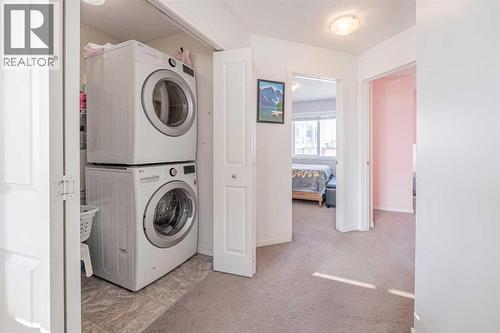 180 Panatella Way Nw, Calgary, AB - Indoor Photo Showing Laundry Room
