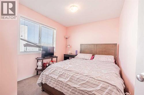 180 Panatella Way Nw, Calgary, AB - Indoor Photo Showing Bedroom