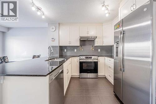 180 Panatella Way Nw, Calgary, AB - Indoor Photo Showing Kitchen With Stainless Steel Kitchen With Upgraded Kitchen
