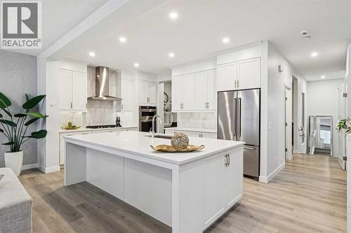 153 Edith Villas Nw, Calgary, AB - Indoor Photo Showing Kitchen With Upgraded Kitchen