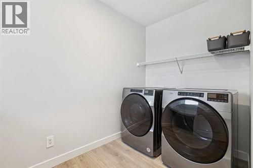 153 Edith Villas Nw, Calgary, AB - Indoor Photo Showing Laundry Room