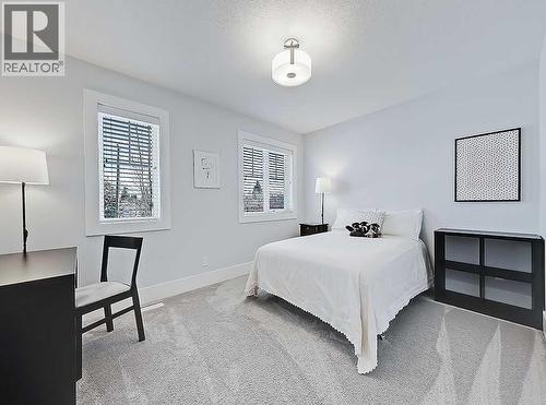14 Rosetree Road Nw, Calgary, AB - Indoor Photo Showing Bedroom