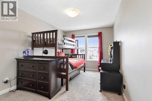 26 Marquis Heights Se, Calgary, AB - Indoor Photo Showing Bedroom