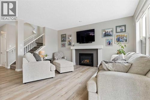 26 Marquis Heights Se, Calgary, AB - Indoor Photo Showing Living Room With Fireplace
