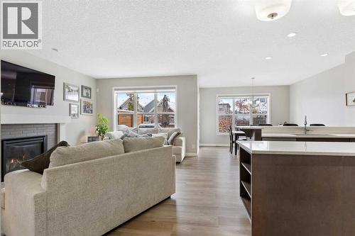 26 Marquis Heights Se, Calgary, AB - Indoor Photo Showing Living Room With Fireplace