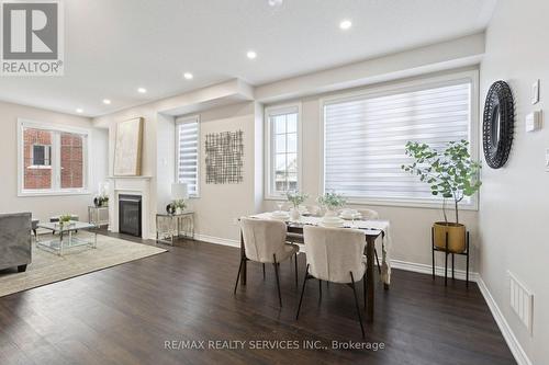47 Dass Drive E, Centre Wellington, ON - Indoor Photo Showing Dining Room With Fireplace