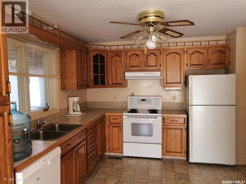 144 2Nd Street W, Ponteix, SK - Indoor Photo Showing Kitchen With Double Sink