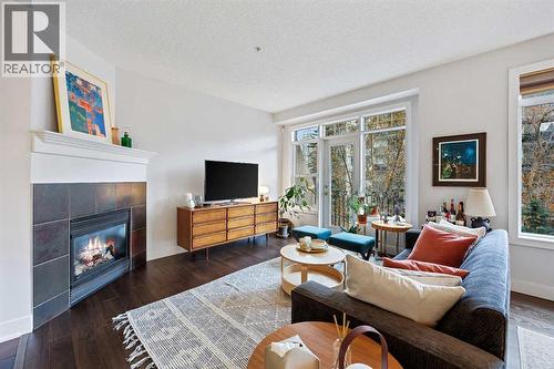 304, 923 15 Avenue Sw, Calgary, AB - Indoor Photo Showing Living Room With Fireplace