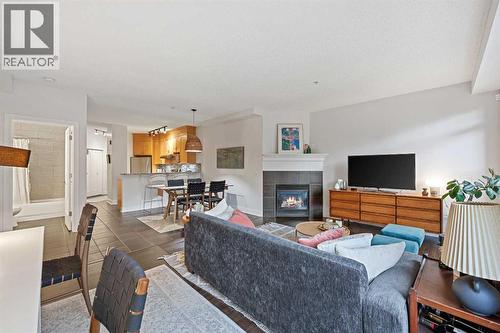 304, 923 15 Avenue Sw, Calgary, AB - Indoor Photo Showing Living Room With Fireplace