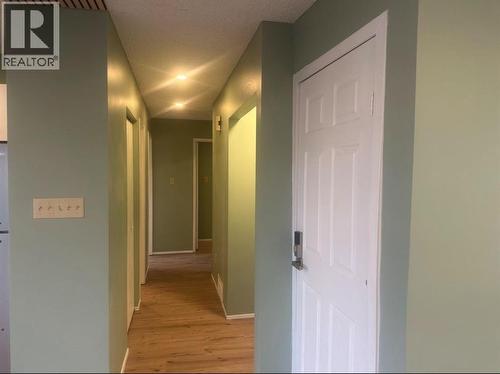 Bedrooms Hallway - 52 Wildrose Crescent, Brooks, AB - Indoor Photo Showing Other Room