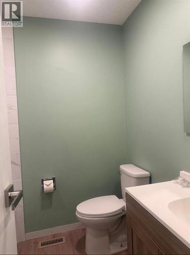 bathroom - 52 Wildrose Crescent, Brooks, AB - Indoor Photo Showing Bathroom