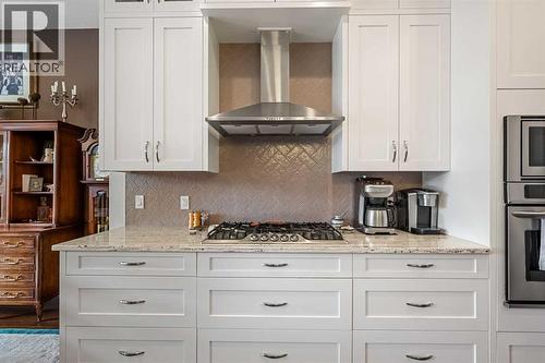Ceiling height cabinetry, no dusting required! - 2253 Bayside Road Sw, Airdrie, AB - Indoor Photo Showing Kitchen With Upgraded Kitchen