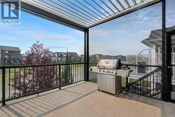 This custom, extended back deck impresses with natural sunlight and sun coast screens - 