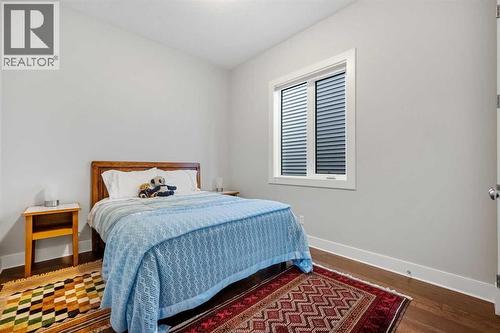 You have an additional guest bedroom on the main  level - 2253 Bayside Road Sw, Airdrie, AB - Indoor Photo Showing Bedroom