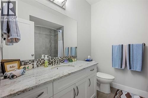 An additional four piece guest bathroom located in the basement - 2253 Bayside Road Sw, Airdrie, AB - Indoor Photo Showing Bathroom