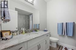 An additional four piece guest bathroom located in the basement - 