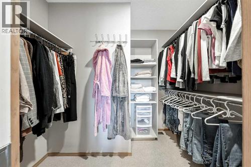 Primary Walk in Closet - 9 Hidden Valley Crescent Nw, Calgary, AB - Indoor With Storage