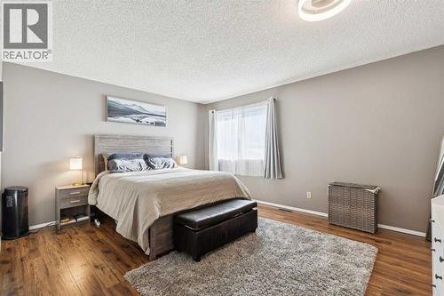 205 Acacia Drive Se, Airdrie, AB - Indoor Photo Showing Bedroom