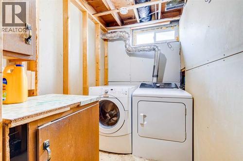 205 Acacia Drive Se, Airdrie, AB - Indoor Photo Showing Laundry Room
