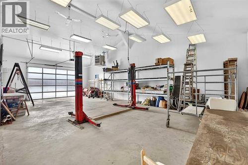 33235 Range Road 64, Rural Mountain View County, AB - Indoor Photo Showing Garage