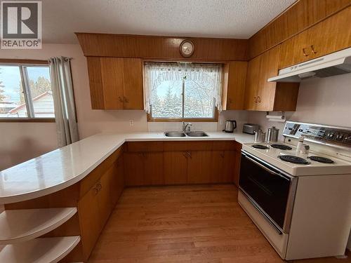 U shaped kitchen - 5317 47Th Street, High Prairie, AB - Indoor Photo Showing Kitchen With Double Sink