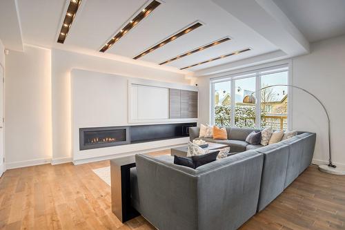Salon - 50 Rue De L'Oiselet, Carignan, QC - Indoor Photo Showing Living Room With Fireplace