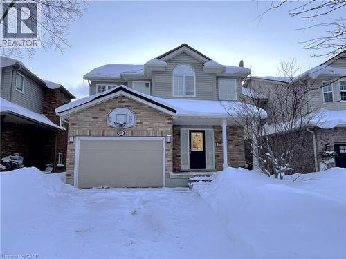 View of front of property with a garage and a porch - 443 Lausanne Crescent, Waterloo, ON - Outdoor With Facade