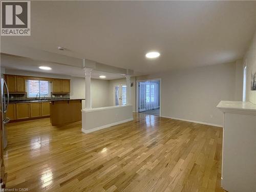 Unfurnished living room featuring light wood-type flooring and recessed lighting - 443 Lausanne Crescent, Waterloo, ON - Indoor