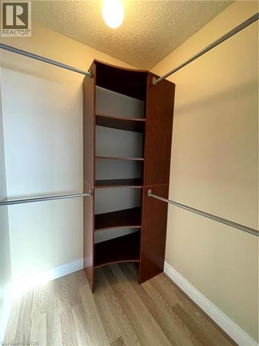 Walk in closet featuring light wood-style flooring - 443 Lausanne Crescent, Waterloo, ON - Indoor Photo Showing Other Room