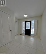 Foyer with light tile patterned flooring - 