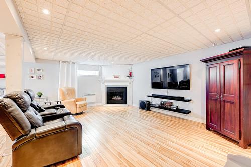 Salle familiale - 87 Rue De Caplan, Blainville, QC - Indoor Photo Showing Living Room With Fireplace