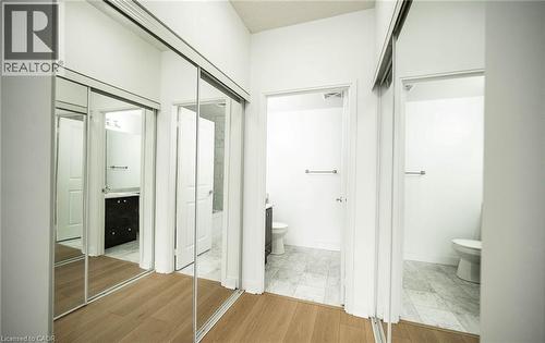 Bathroom featuring light wood-type flooring and a textured ceiling - 50 Absolute Avenue Unit# 2105, Mississauga, ON - Indoor