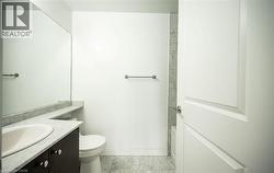 Full bathroom with vanity, washtub / shower combination, and light marble finish floors - 