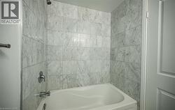 Bathroom featuring bathtub / shower combination - 
