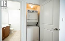 Laundry room with stacked washer and clothes dryer - 